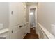 A half bathroom with dark hardwood floors at 230 Waltham Way, Fayetteville, GA 30214