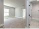 Simple bedroom with carpet and ensuite bathroom at 230 Waltham Way, Fayetteville, GA 30214