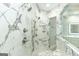 Spa-like shower with multiple shower heads and marble tile at 230 Waltham Way, Fayetteville, GA 30214