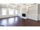 Living room with hardwood floors, fireplace, and built-in shelving at 230 Waltham Way, Fayetteville, GA 30214