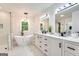 Luxurious bathroom with double vanity, free-standing tub and large shower at 2705 Baker Ridge Nw Dr, Atlanta, GA 30318