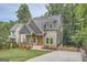 Modern two-story home with gray siding and a front porch at 1055 Church St, Smyrna, GA 30080