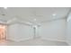 Spacious unfinished basement with light neutral walls and vinyl flooring at 1055 Church St, Smyrna, GA 30080