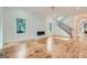 Bright living room features hardwood floors, a fireplace, and an open staircase at 1055 Church St, Smyrna, GA 30080
