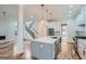 Modern kitchen with a large island, stainless steel appliances, and white cabinets at 1055 Church St, Smyrna, GA 30080
