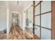 Bright entryway with hardwood floors and glass French doors at 1055 Church St, Smyrna, GA 30080