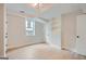 Unfinished basement bedroom with built-in shelving and hardwood floors at 1055 Church St, Smyrna, GA 30080
