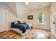 Cozy bedroom with hardwood floors and a large window at 1055 Church St, Smyrna, GA 30080