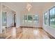 Bright dining room with hardwood floors, large windows and chandelier at 1055 Church St, Smyrna, GA 30080