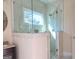 Large walk in shower with glass enclosure and tile surround at 321 Seventh Ave, Scottdale, GA 30079