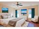 Bright bedroom with hardwood floors, a dresser, and large windows at 321 Seventh Ave, Scottdale, GA 30079