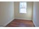 Small bedroom with hardwood floors and a window at 321 Seventh Ave, Scottdale, GA 30079