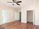 Bedroom with hardwood floors, access to bathroom and closet at 321 Seventh Ave, Scottdale, GA 30079