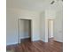 Bedroom with hardwood floors and access to closets at 321 Seventh Ave, Scottdale, GA 30079