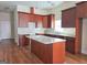Kitchen with island and dark wood cabinets at 321 Seventh Ave, Scottdale, GA 30079
