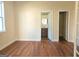 Spacious main bedroom with hardwood floors, large windows, and ceiling fan at 321 Seventh Ave, Scottdale, GA 30079