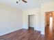 Bedroom with hardwood floors and access to closets and hallway at 321 Seventh Ave, Scottdale, GA 30079