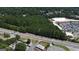 Aerial view of a wooded lot near a road and shopping center at 4556 Wade Green Nw Rd, Acworth, GA 30102