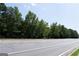 Wooded lot next to a roadway at 4556 Wade Green Nw Rd, Acworth, GA 30102