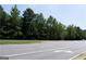 Vacant lot with mature trees bordering a road at 4556 Wade Green Nw Rd, Acworth, GA 30102