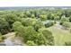 Aerial view of the house and surrounding landscape at 1092 Harbins Rd, Dacula, GA 30019