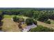 House with detached shed and large yard shown in this aerial view at 1092 Harbins Rd, Dacula, GA 30019