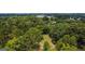 Aerial view of property showcasing a wooded lot at 1092 Harbins Rd, Dacula, GA 30019