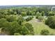 House with spacious yard and surrounding trees, aerial view at 1092 Harbins Rd, Dacula, GA 30019