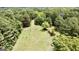 Aerial view of property with small shed and trees at 1092 Harbins Rd, Dacula, GA 30019