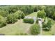 Aerial view of home with a large backyard and trees at 1092 Harbins Rd, Dacula, GA 30019