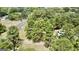 Aerial view of property near a road with lush trees at 1092 Harbins Rd, Dacula, GA 30019