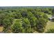 Aerial view of property showcasing house and lush green landscape at 1072 Harbins Rd, Dacula, GA 30019