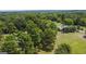 Aerial view showing home, large lot, and surrounding trees at 1072 Harbins Rd, Dacula, GA 30019