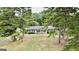 Aerial view of house with circular driveway and ample green space at 1072 Harbins Rd, Dacula, GA 30019