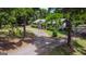 Aerial view of charming ranch home with long driveway at 1072 Harbins Rd, Dacula, GA 30019
