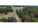 Aerial view of property near a road and businesses at 1072 Harbins Rd, Dacula, GA 30019