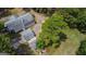 Aerial view of house, detached garage, and expansive green space at 1072 Harbins Rd, Dacula, GA 30019