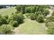 Aerial view of vacant lot with lush green landscape at 1072 Harbins Rd, Dacula, GA 30019