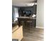 Modern kitchen with stainless steel appliances and an island with seating at 25 Franklin Way, Covington, GA 30016