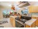 Kitchen boasts stainless steel appliances and a large island at 371 Oakland Rd, Mcdonough, GA 30253