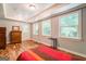 Bedroom with wood floors, multiple windows and a door at 371 Oakland Rd, Mcdonough, GA 30253