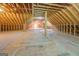 Large unfinished attic room with high ceilings at 371 Oakland Rd, Mcdonough, GA 30253