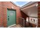 Green front door with a circular window and brick exterior at 389 Ralph Mcgill Ne Blvd # E, Atlanta, GA 30312