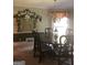 Formal dining room with chandelier and painted accent wall at 1145 Lake Stone Lea Dr, Oxford, GA 30054