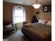Bedroom with a king-size bed and a bench at 1145 Lake Stone Lea Dr, Oxford, GA 30054
