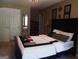 Bedroom with a double bed, dresser, and large mirror at 1145 Lake Stone Lea Dr, Oxford, GA 30054