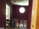 Upper hallway with octagonal window and chandelier at 1145 Lake Stone Lea Dr, Oxford, GA 30054