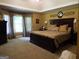 Large main bedroom with plush carpet and ensuite bathroom at 1145 Lake Stone Lea Dr, Oxford, GA 30054