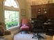 Bright office space with large window and wood furniture at 1145 Lake Stone Lea Dr, Oxford, GA 30054