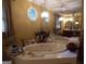 Relaxing bathroom with corner jetted tub and stylish fixtures at 1145 Lake Stone Lea Dr, Oxford, GA 30054